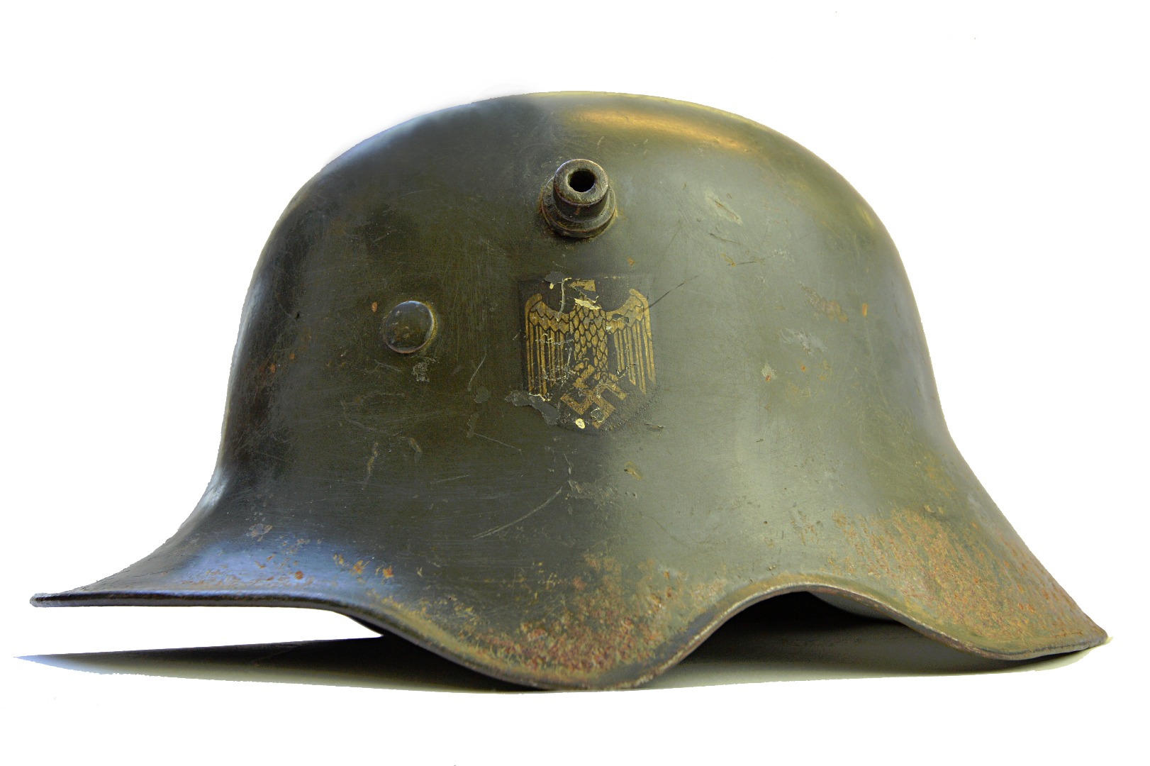 Appraisal: A World War Two German army helmet green painted with