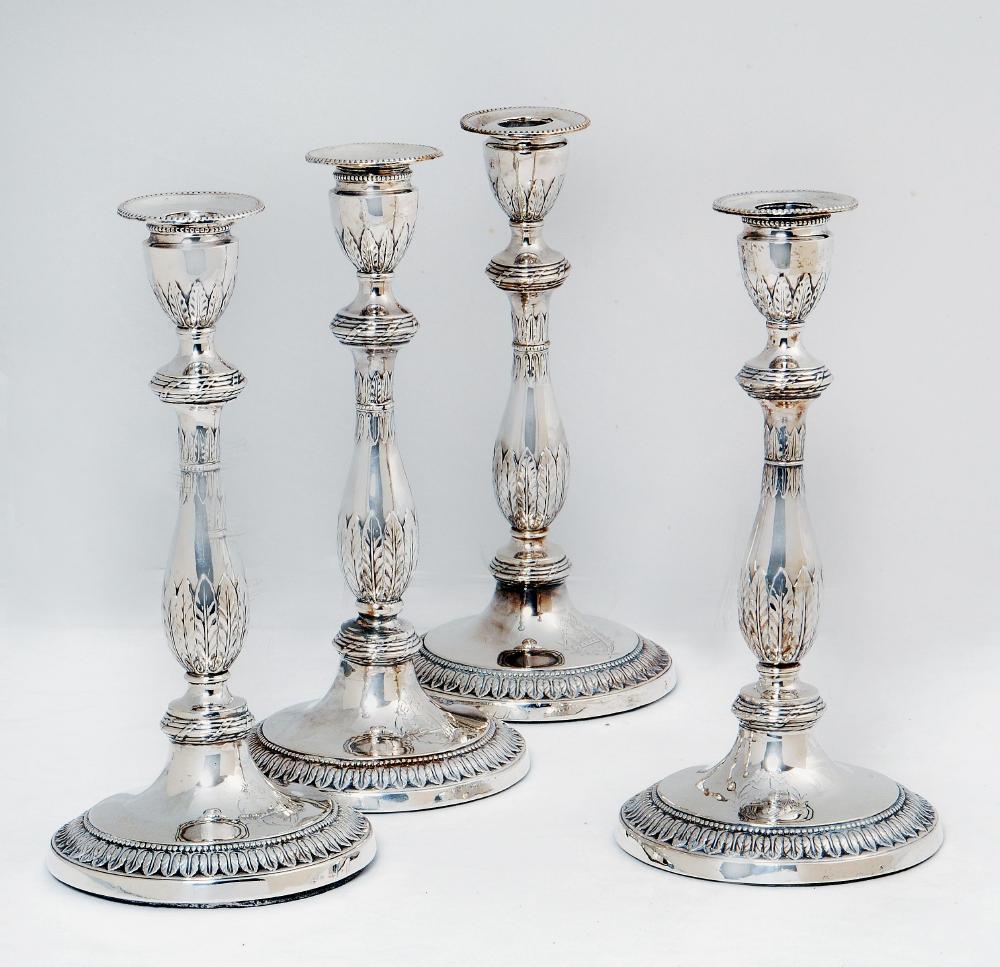 Appraisal: A SET OF FOUR GEORGE III CANDLESTICKS maker Young Greaves