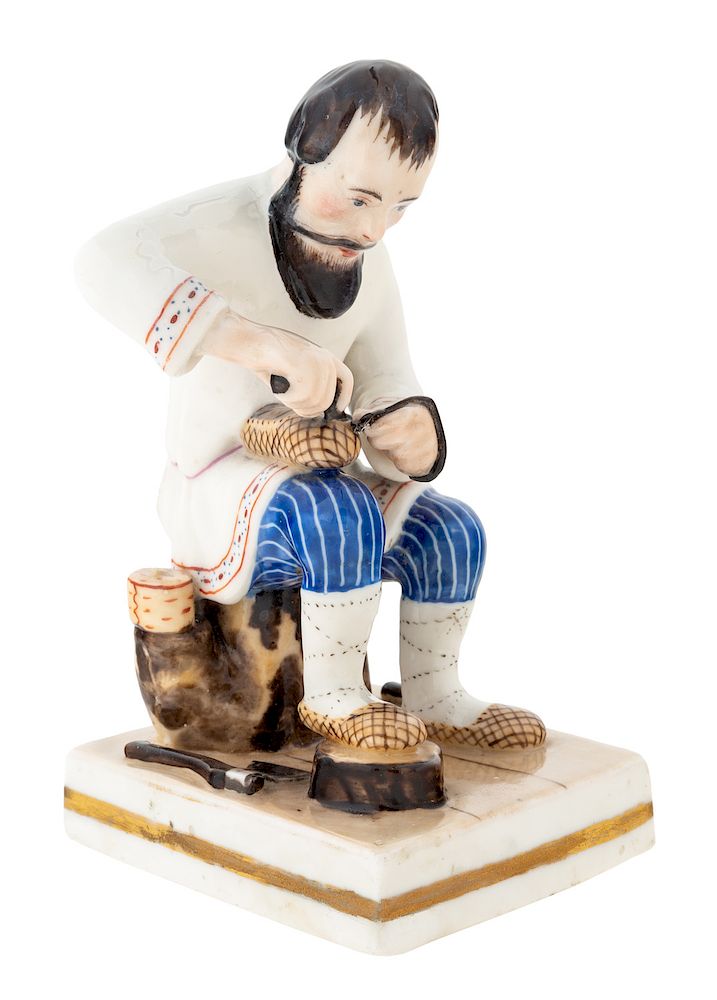 Appraisal: A RUSSIAN PORCELAIN FIGURE OF A BAST SHOE COBBLER MIKLASHEVSKY