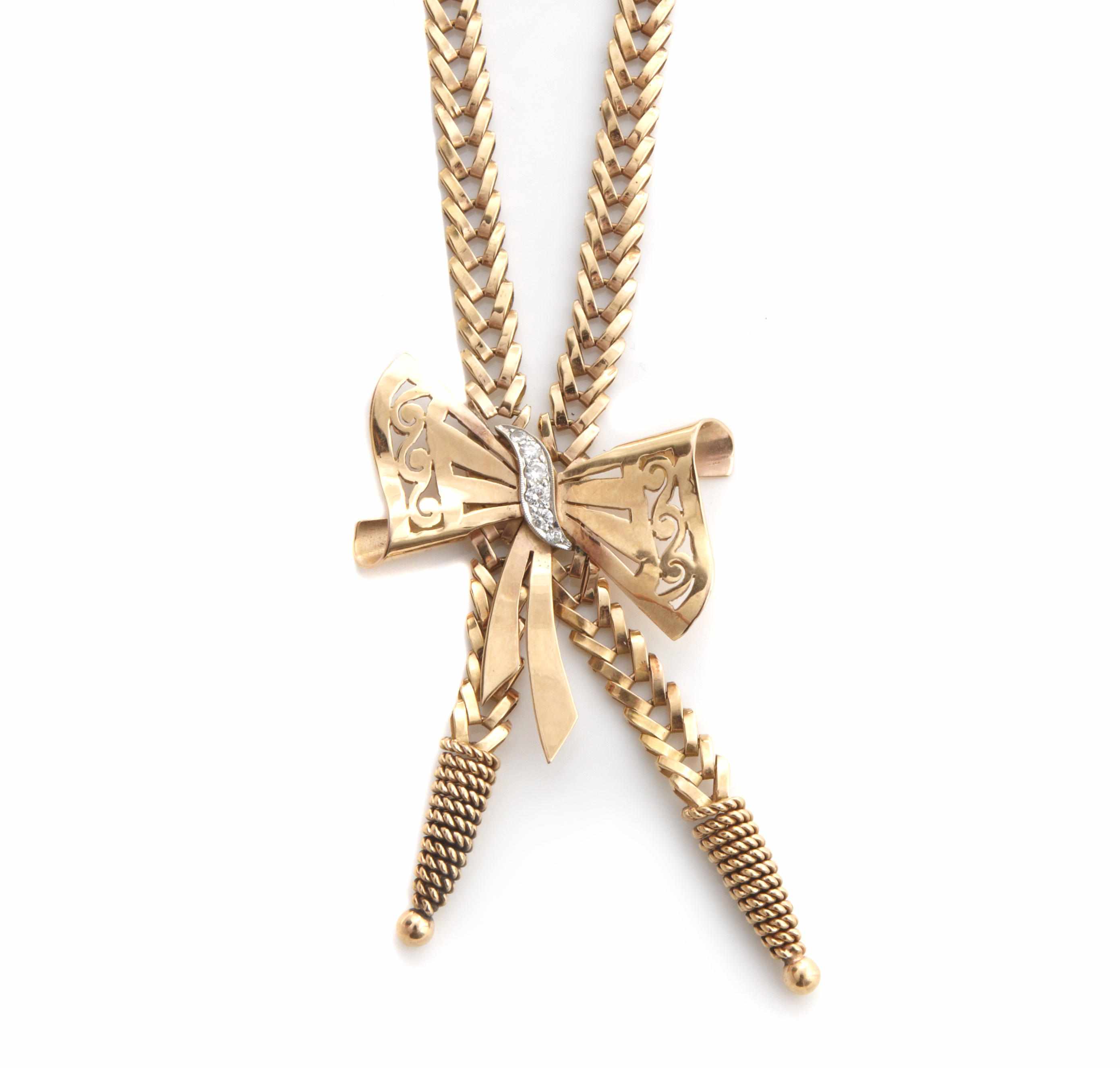 Appraisal: A diamond and k bicolor gold bow and tassel necklace