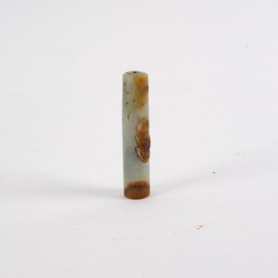 Appraisal: A Chinese mutton fat jade pen handle carved with a