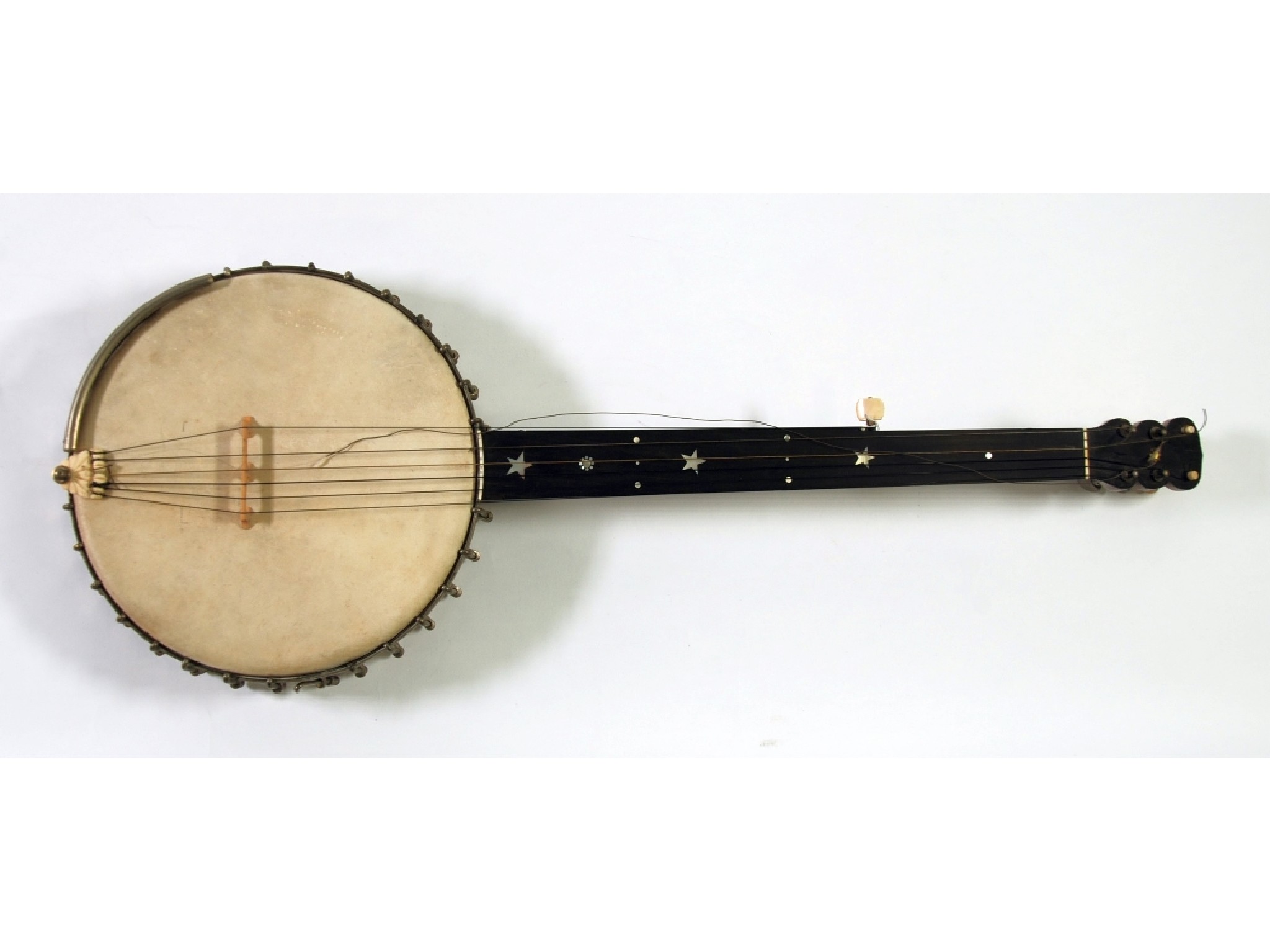 Appraisal: T W BACON LONDON FRETLESS BANJO with seven pegs stellate