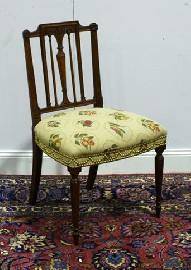 Appraisal: A George III style mahogany and upholstered occasional chair