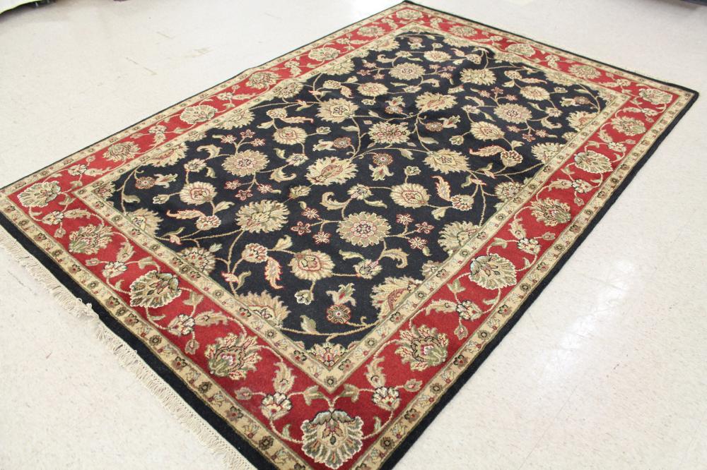 Appraisal: HAND KNOTTED ORIENTAL CARPET Indo-Persian overall floral design on black