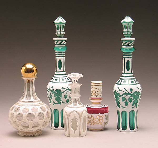 Appraisal: Five Bohemian white cased cut to clear decanters or bottles