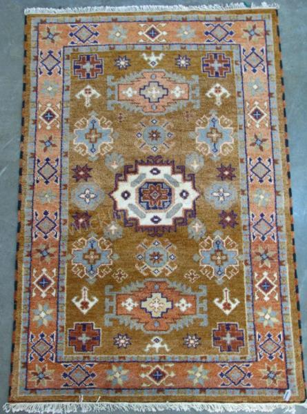 Appraisal: Handmade Oriental Area Rug Kazak design light brown field with