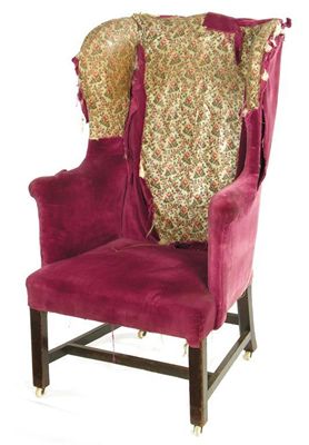 Appraisal: A George III wing armchair on square chamfered legs united