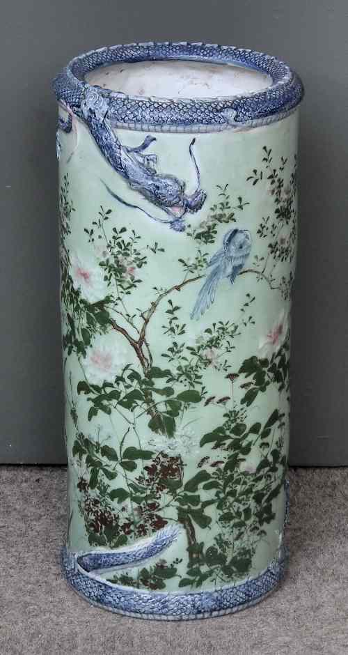 Appraisal: A Japanese porcelain umbrella stand moulded and painted with flowering