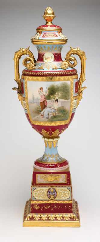 Appraisal: A Royal Vienna style porcelain covered urn on stand Probably