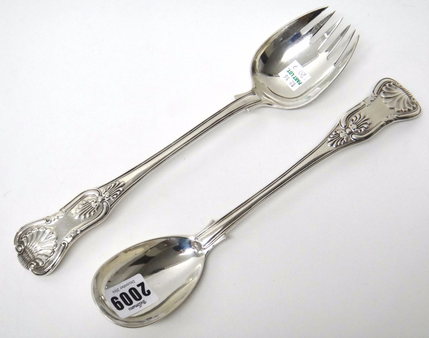 Appraisal: A matched pair of silver King's pattern salad servers London