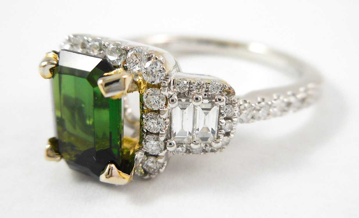 Appraisal: GREEN TOURMALINE AND DIAMOND RING The k white and yellow