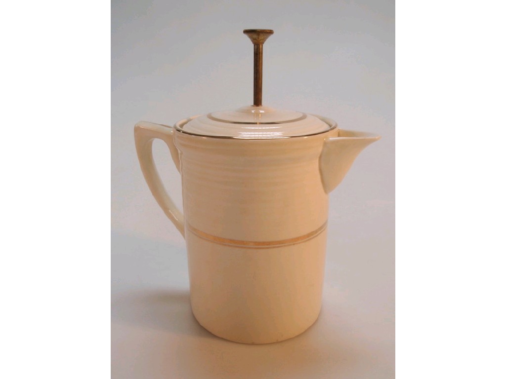 Appraisal: A Booths pottery coffee pot with cream glaze and gilt