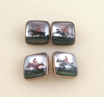 Appraisal: A pair of gold mounted carved crystal cufflinks depicting hunting