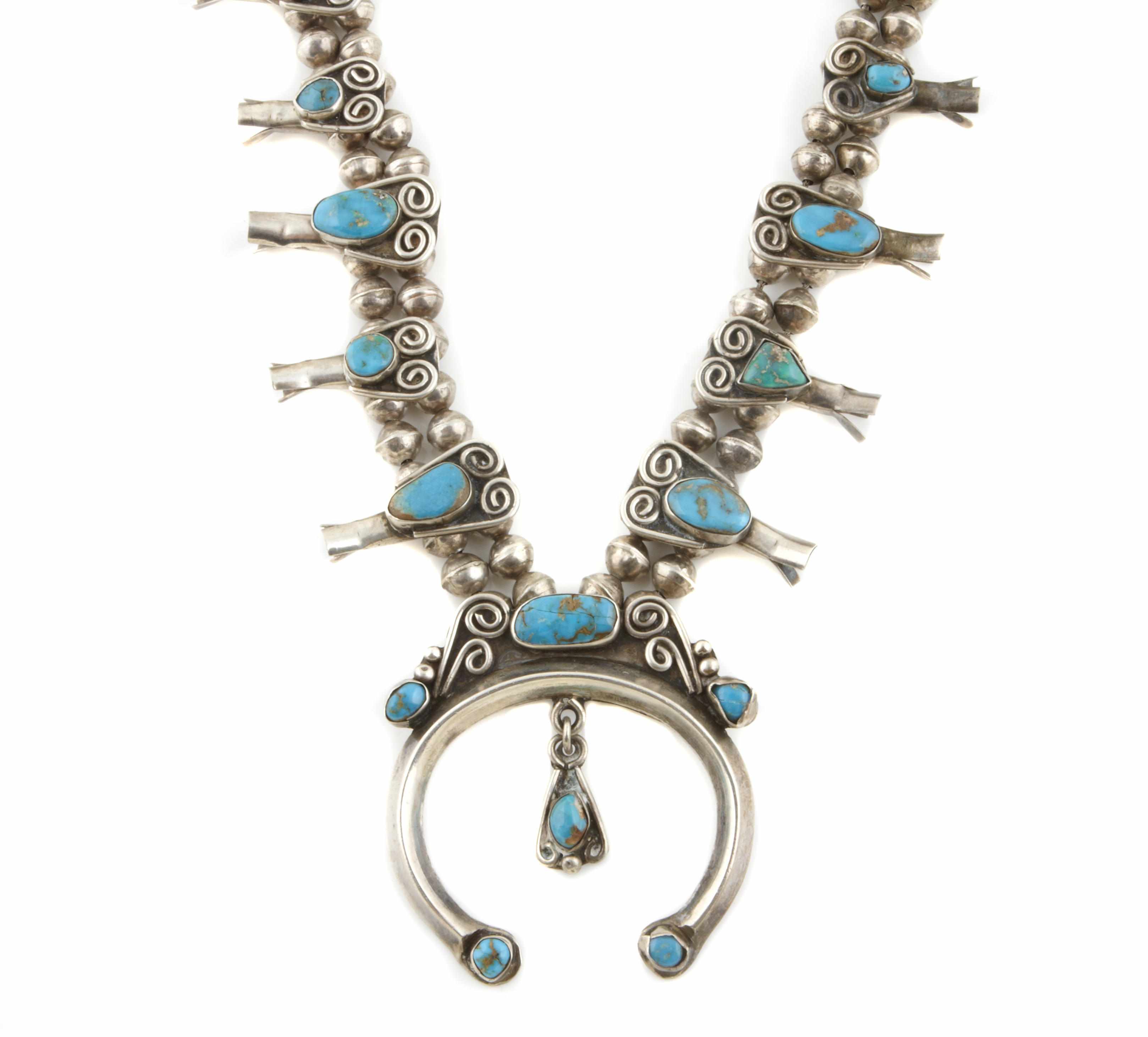 Appraisal: A turquoise and silver squash blossom necklace