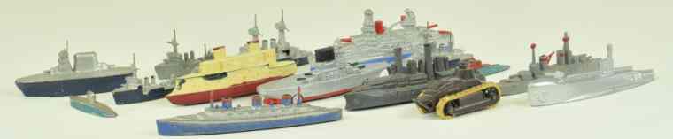 Appraisal: GROUPING OF SLUDGE CAST TOYS Extensive lot includes battleships made