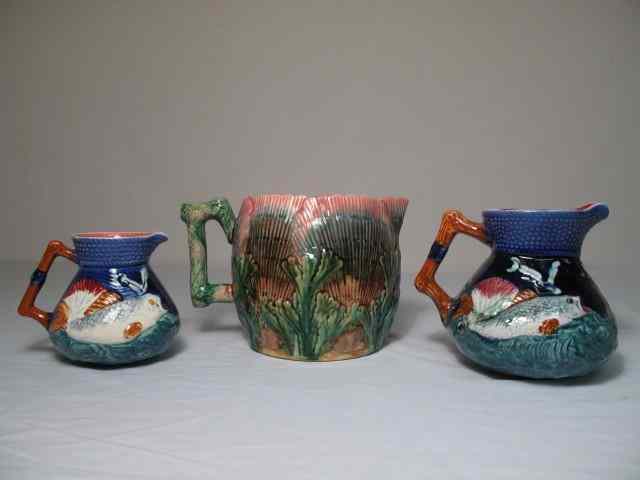 Appraisal: Three Majolica pottery pitchers Includes Etruscan shell seaweed pattern and