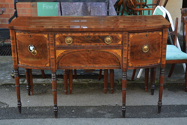 Appraisal: A mahogany and inlaid bow front sideboardfitted drawers to the