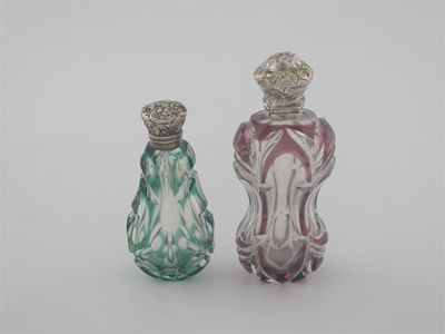 Appraisal: Two Victorian mounted cut-glass scent bottles with embossed hinged covers