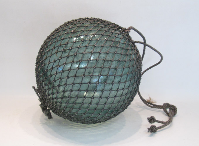 Appraisal: JAPANESE GLASS FISHING FLOAT with original net Diameter inches