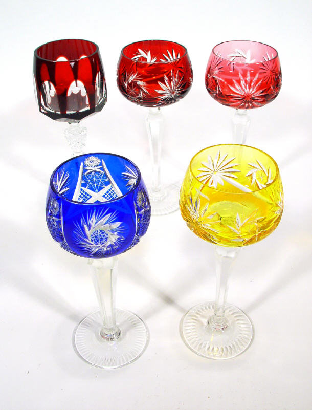 Appraisal: Set of four Bohemian coloured cut wine glasses together with