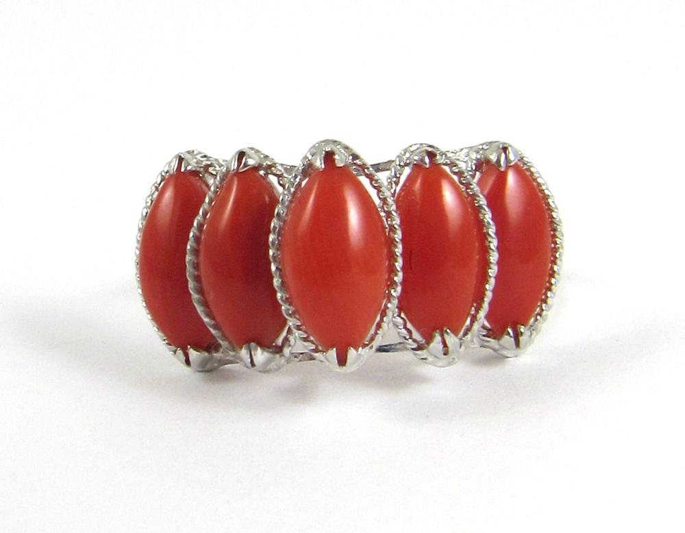 Appraisal: CORAL AND FOURTEEN KARAT WHITE GOLD RING with five marquise