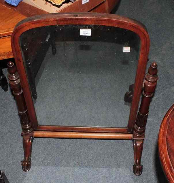 Appraisal: A WILLIAM IV MAHOGANY SWING TOILET MIRROR on carved and