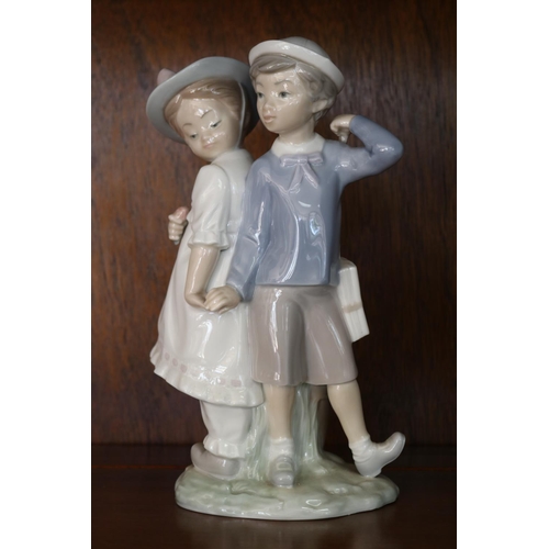 Appraisal: Lladro figure - girl and boy holding hands approx cm