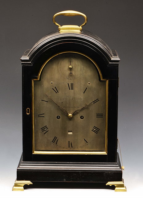 Appraisal: A GEORGE III EBONISED BRACKET CLOCK the break arch silvered