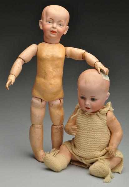 Appraisal: Two Bisque Character Dolls Description German bisque socket head incised