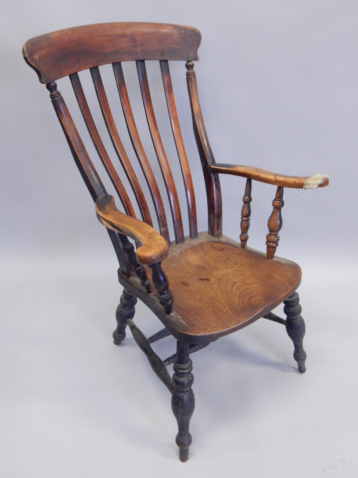 Appraisal: An thC slat back Windsor chair with solid elm seat