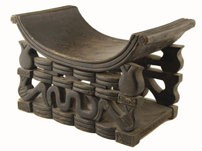 Appraisal: A Duala stool Cameroon with a dished seat and carved