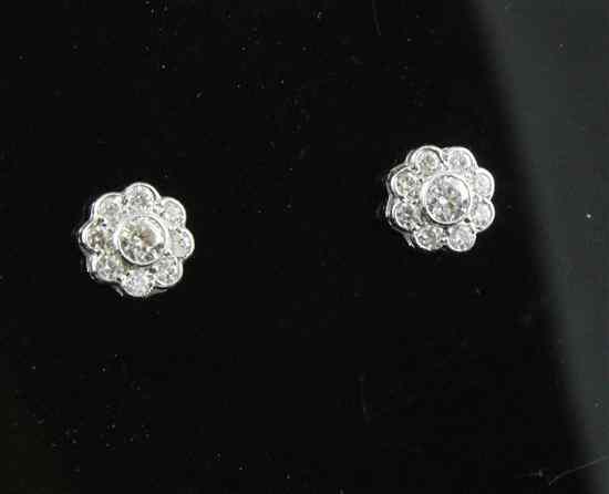 Appraisal: A pair of ct white gold and diamond cluster ear