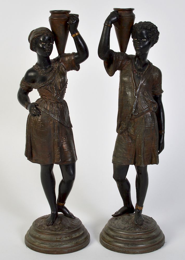 Appraisal: Metal Moorish Figural Candle Holders Metal male and female figures