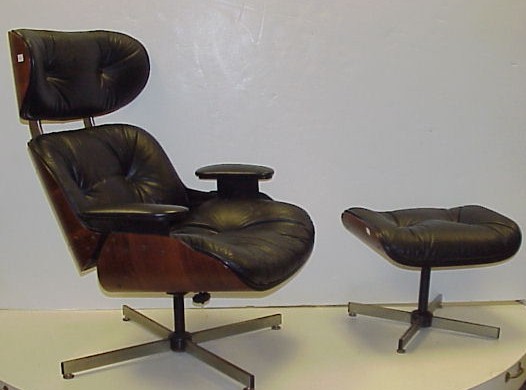 Appraisal: Plycraft chair and ottoman Eames design black vinyl upholstery and