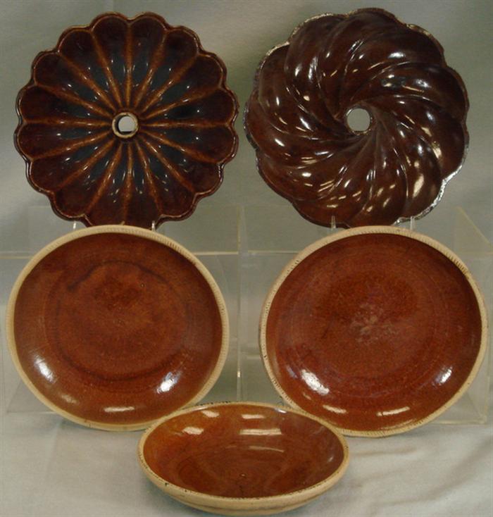 Appraisal: stoneware turks head molds stoneware pie dishes d typical Estimate