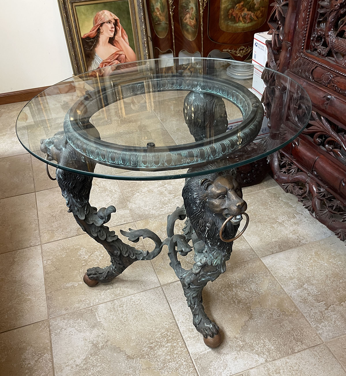 Appraisal: GLASS TOP BRONZE LION MOTIF TABLE Round glass top resting