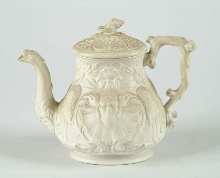 Appraisal: SALT GLAZE DECORATED COVERED TEAPOT Teapot has mask stork and