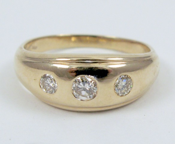 Appraisal: MAN'S DIAMOND AND FOURTEEN KARAT GOLD RING set with three