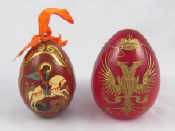 Appraisal: Russian Easter eggs A turned wooden egg painted with St