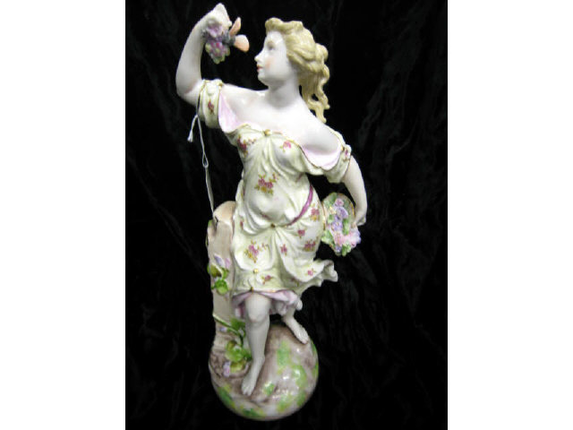 Appraisal: Fine Porcelain Figurine of a Maiden with butterfly flowers