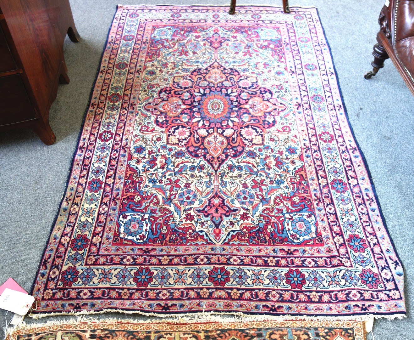 Appraisal: A Kirman Laver rug Persian the ivory field with a