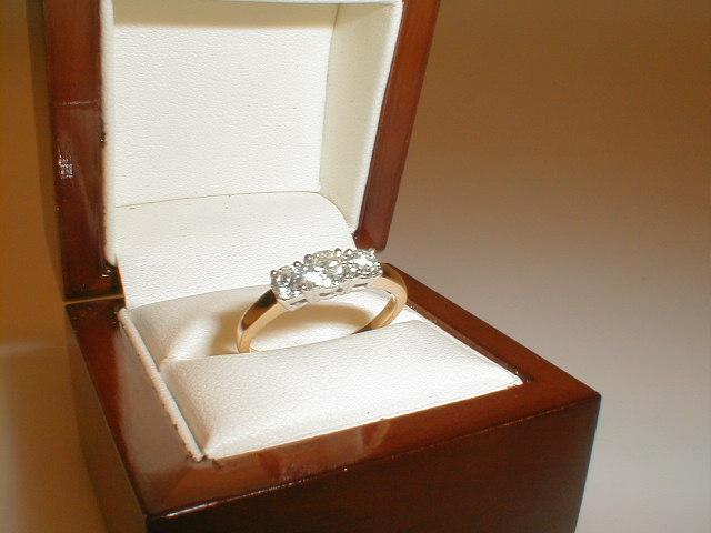 Appraisal: A three stone diamond ring centre stone of ct flanked