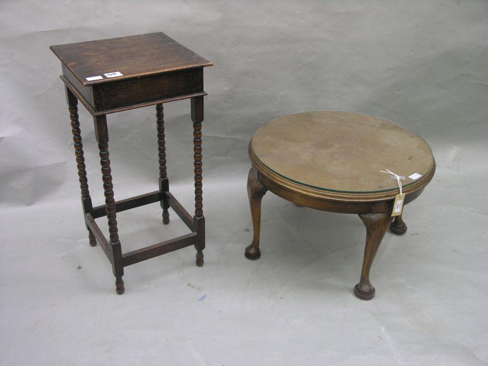 Appraisal: An oak occasional table on ball turned legs in together