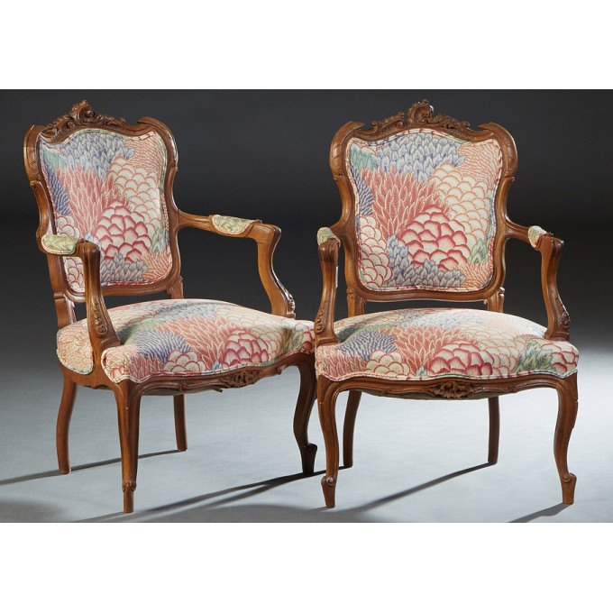 Appraisal: Pair of French Carved Walnut Louis XV Style Fauteuils early