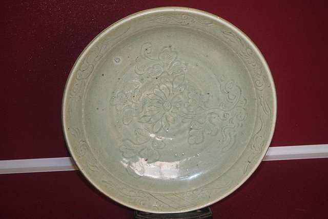 Appraisal: A CHINESE MING CELADON DISH with floral motifs th Century