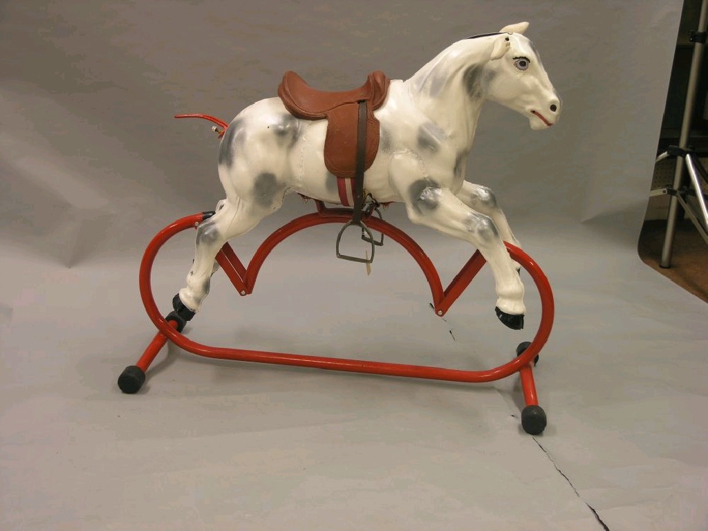 Appraisal: A child's rocking horse galvanised metal horse spray-finished in dapple