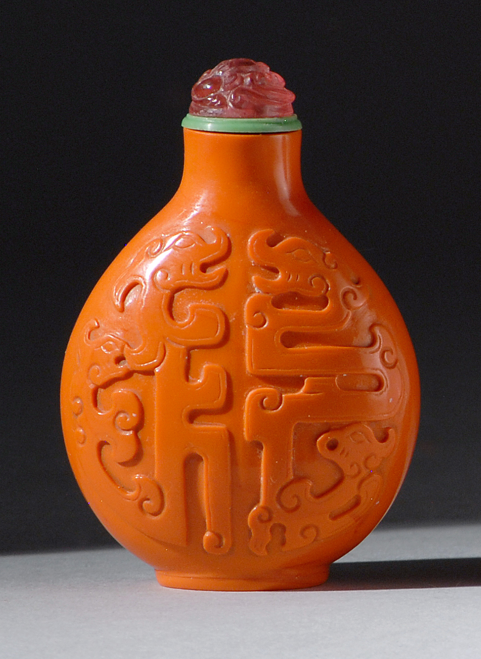 Appraisal: FINELY CARVED GLASS SNUFF BOTTLE th CenturyIn pear shape simulating