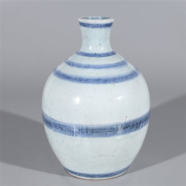 Appraisal: Chinese white glazed ceramic vase with blue concentric rings to