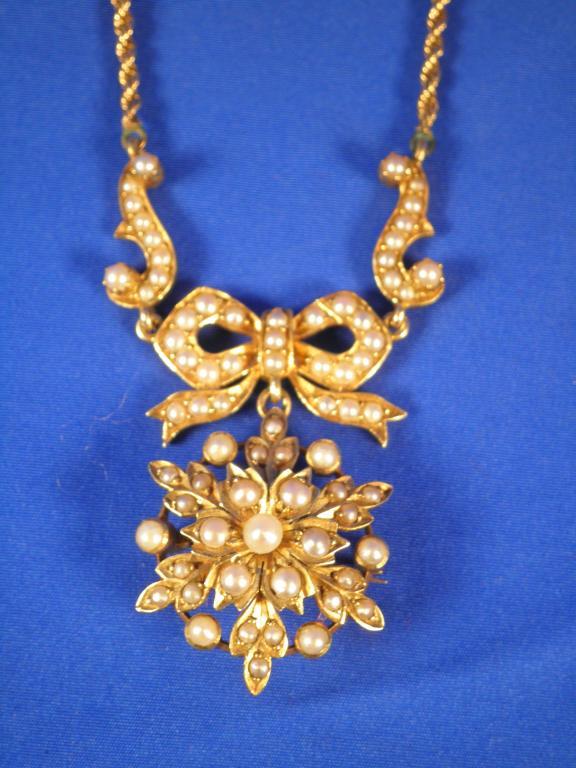 Appraisal: A gold and seed pearl pendant set in the form