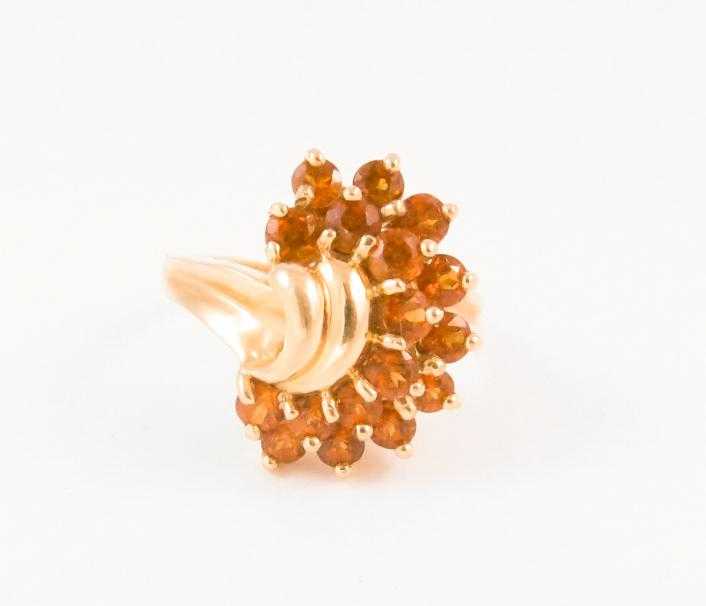 Appraisal: SPESSARTITE GARNET AND TEN KARAT GOLD RING set with a